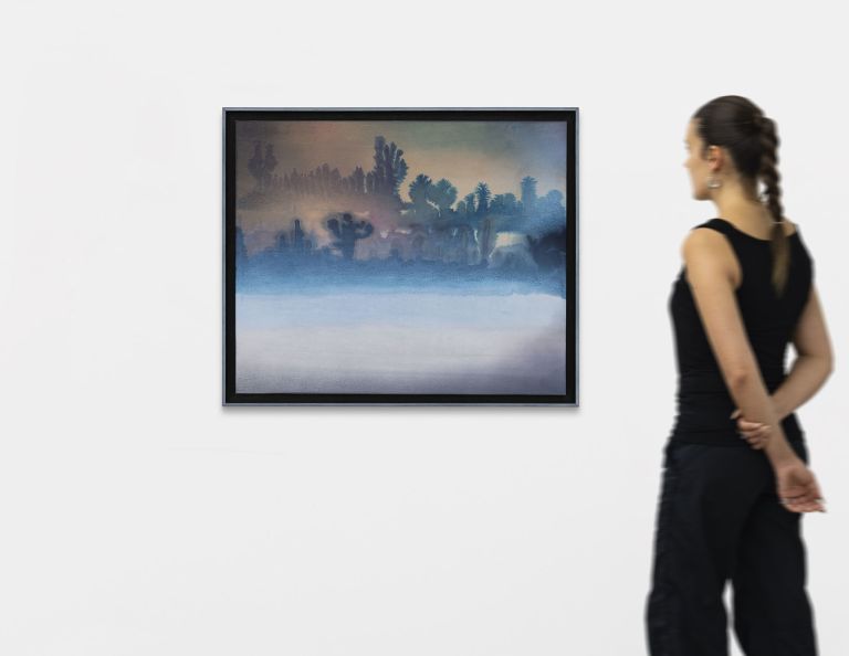 Atmospheric painting of dark tree silhouettes emerging from blue mist, warm pink-orange sky above.