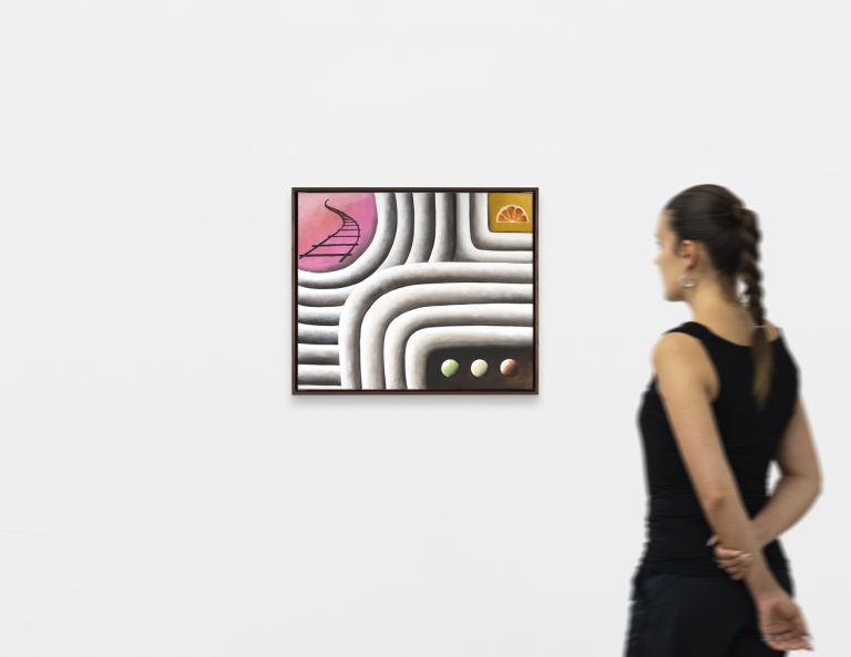 Framed painting of interlocking white cream ridges forming a maze-like pattern, with a pink circle, orange slice, and three small spheres.