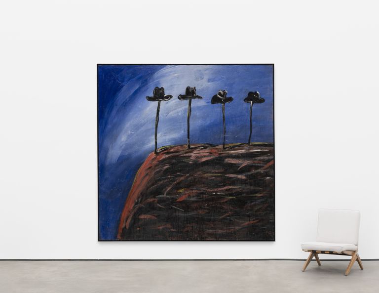 Painting of four black hats on long poles against a dark blue sky and reddish ground