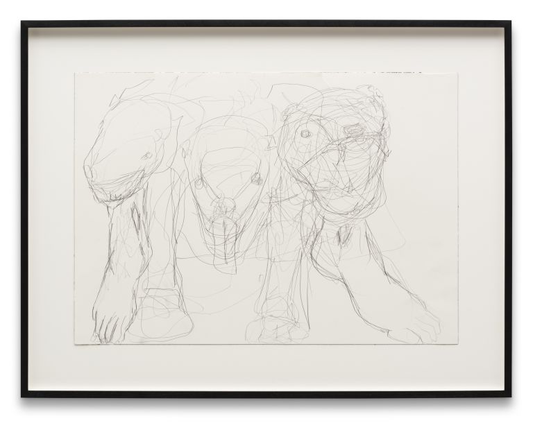 Three framed drawings arranged on white wall showing figural sketches and studies in graphite or charcoal.