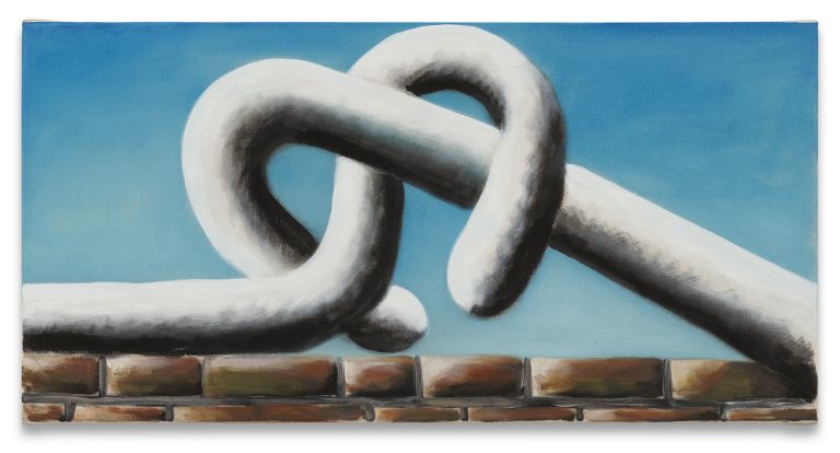 Abstract white sculptural form with flowing, interlocked curves floating against blue sky background above detailed brick wall