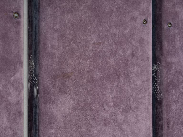 Three tall purple-mauve panels with vertical divisions mounted on white gallery wall.