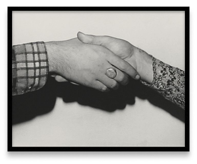 Five framed black and white photographs in a row showing different handshake positions between two people wearing different sleeves