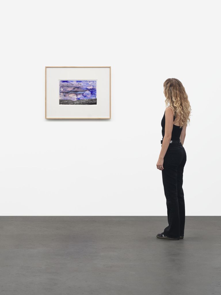 Framed mixed media artwork with purple-blue watercolor sky above black graphite textured ground