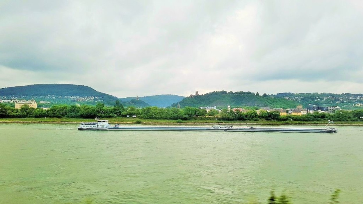 Following the boats down the Rhine on a grey day