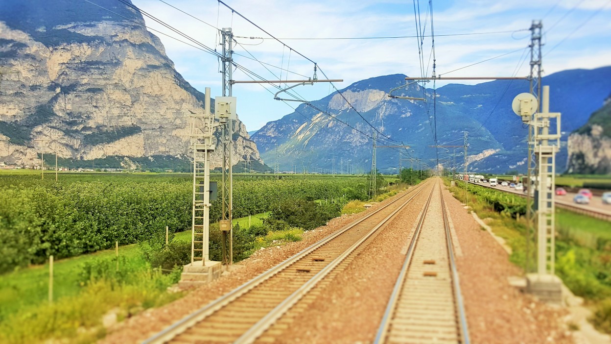 Heading north from Trento taken through the rear window of the last coach on the train