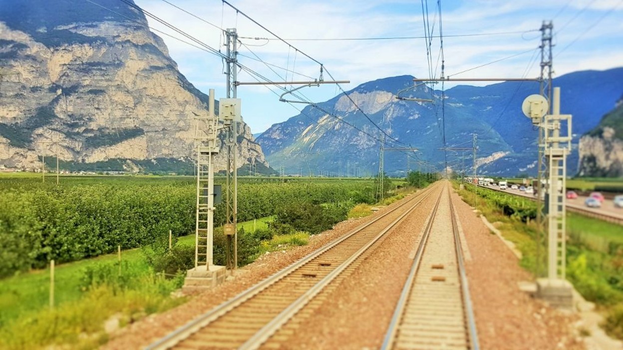 Heading north from Trento taken through the rear window of the last coach on the train