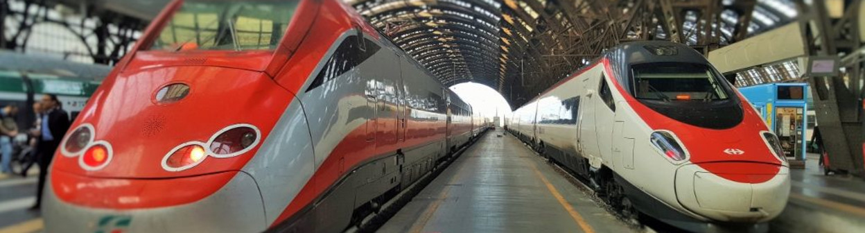 The train on the right has arrived in Milano from Geneve