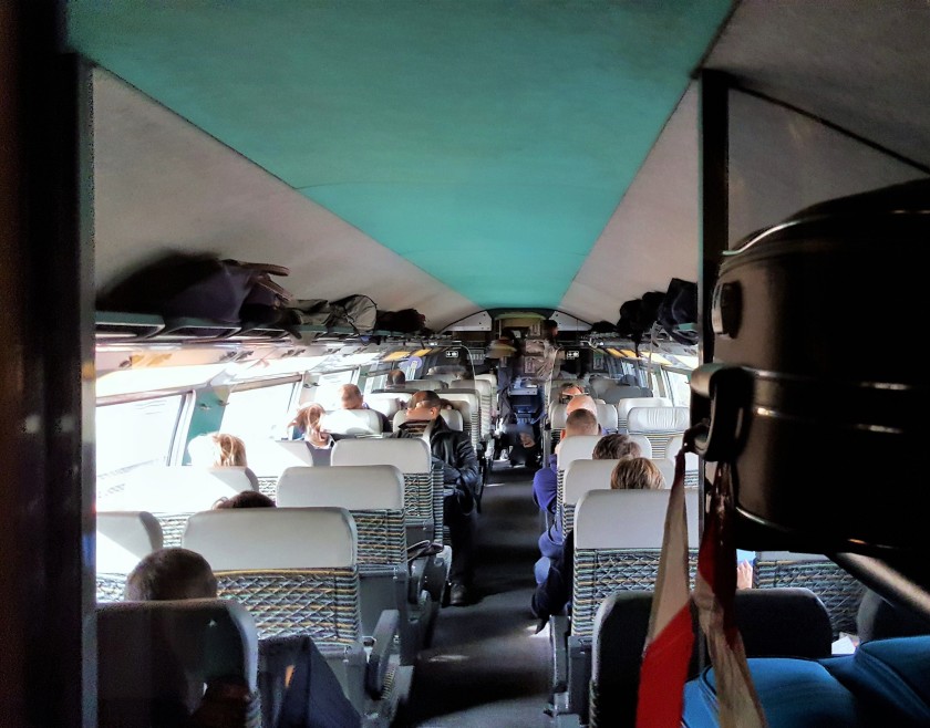 The upper deck seating saloon, note the main luggage rack is outside the seating area