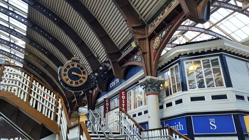 When entering the station the access to the footbridge is behind WH Smith