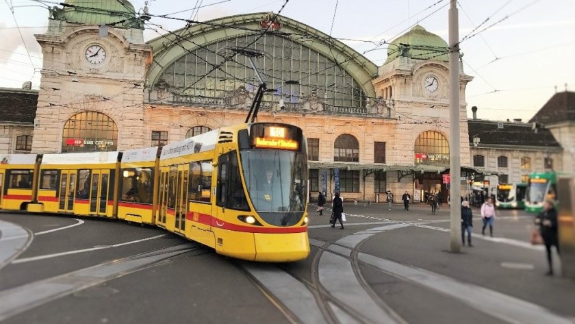 A tram heads for the stops in front of the station