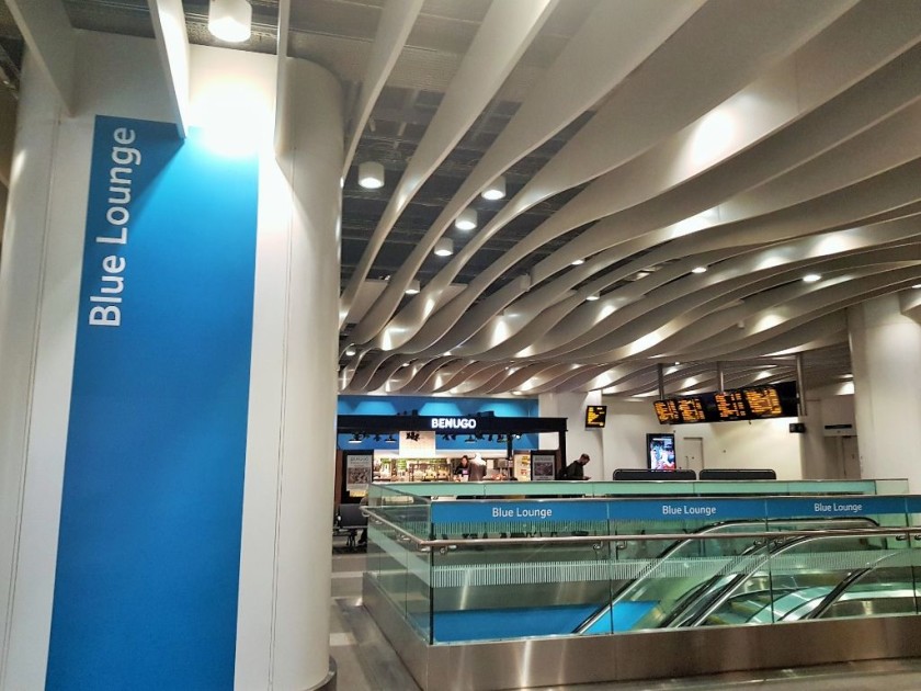 Escalators in the blue and yellow lounges lead down to the trains
