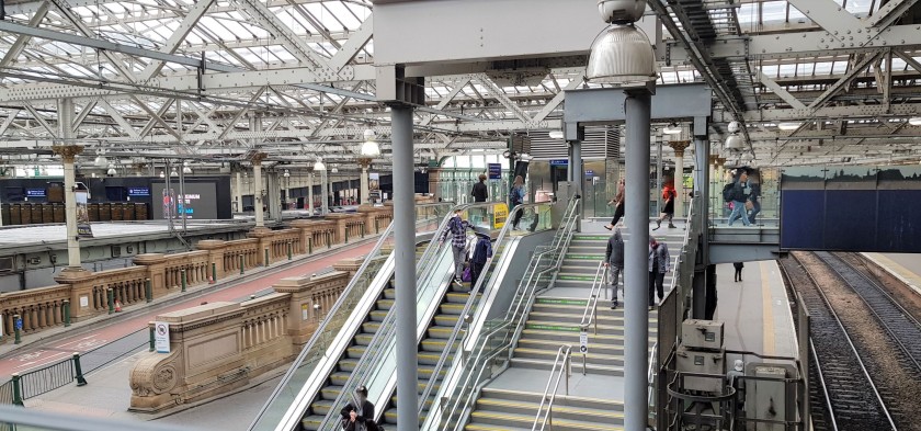 Looking towards this mezzanine level, the escalators are leading down to the concourse area