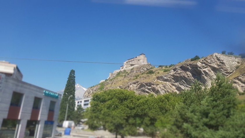 The 11th century Valeré Basilica can be seen on the the left as the train departs Sion station