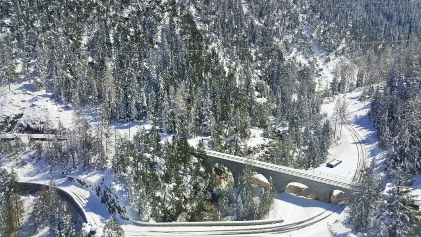 From the spirals the train uses to descend to Samedan