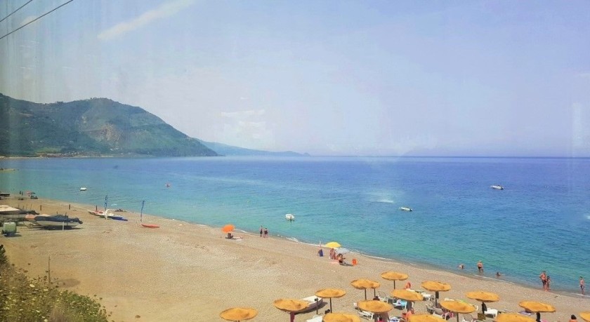 The railway travels by the beaches on Sicily's northern shore