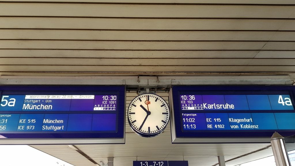 Checking the departure on the platform/gleis at a station in Germany