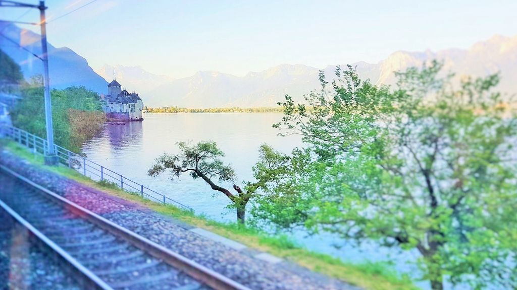 The Chateau de Chillon on Lake Geneva from a train between Milano and Geneva