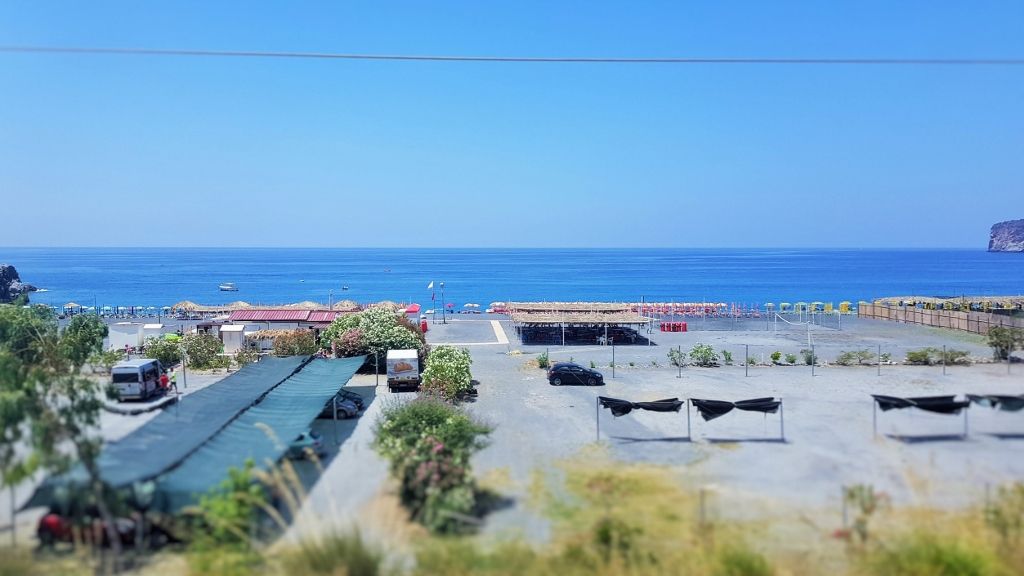 One of dozens of beach resorts that can be seen from the train heading south to Sicily