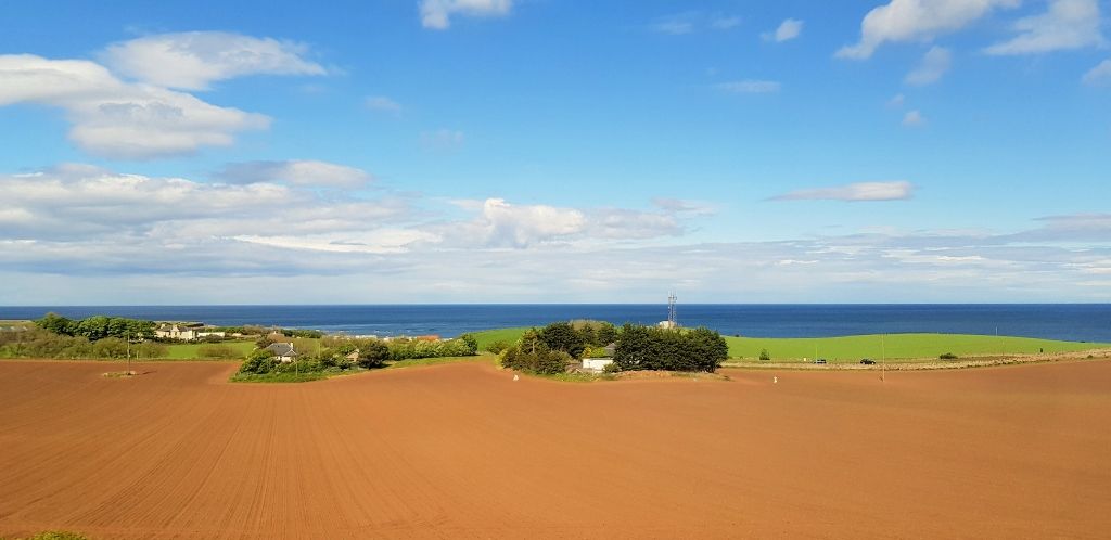 Between Berwick and Dunbar on a train heading to Edinburgh