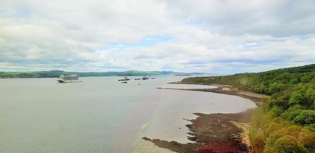 A distant view of the Forth Bridge on a train travelling between Edinburgh and Dundee