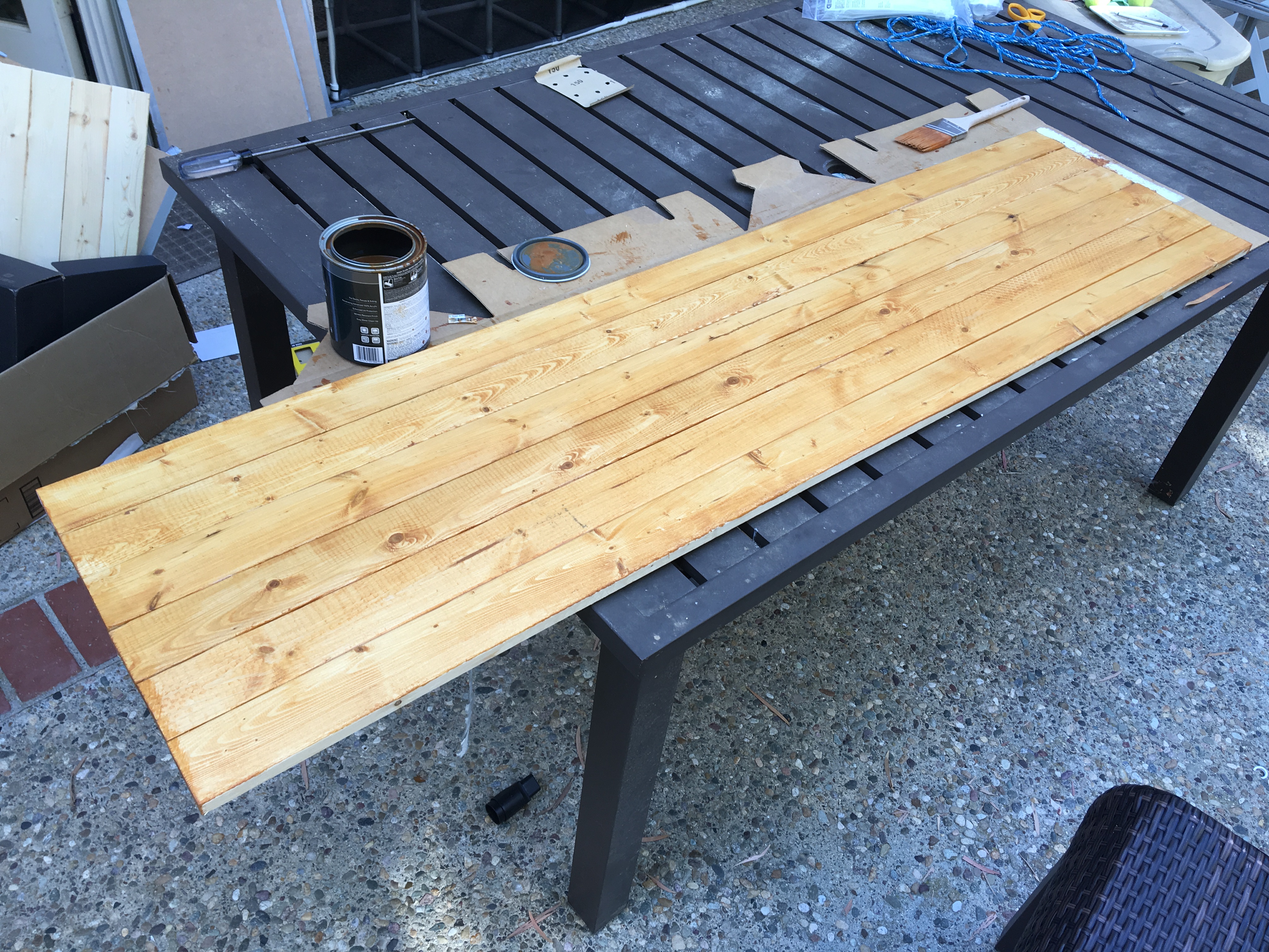 Staining wood for DIY catio with PVC tubes.