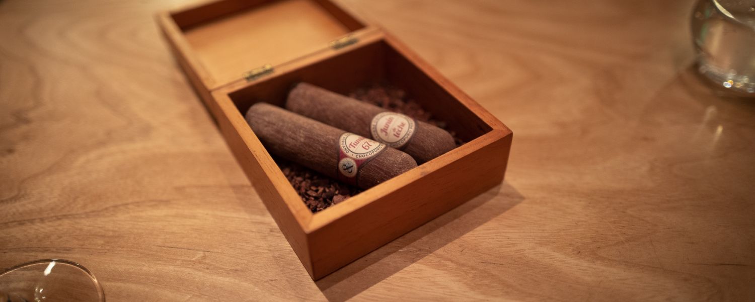 Two cigars presented in a cigar box