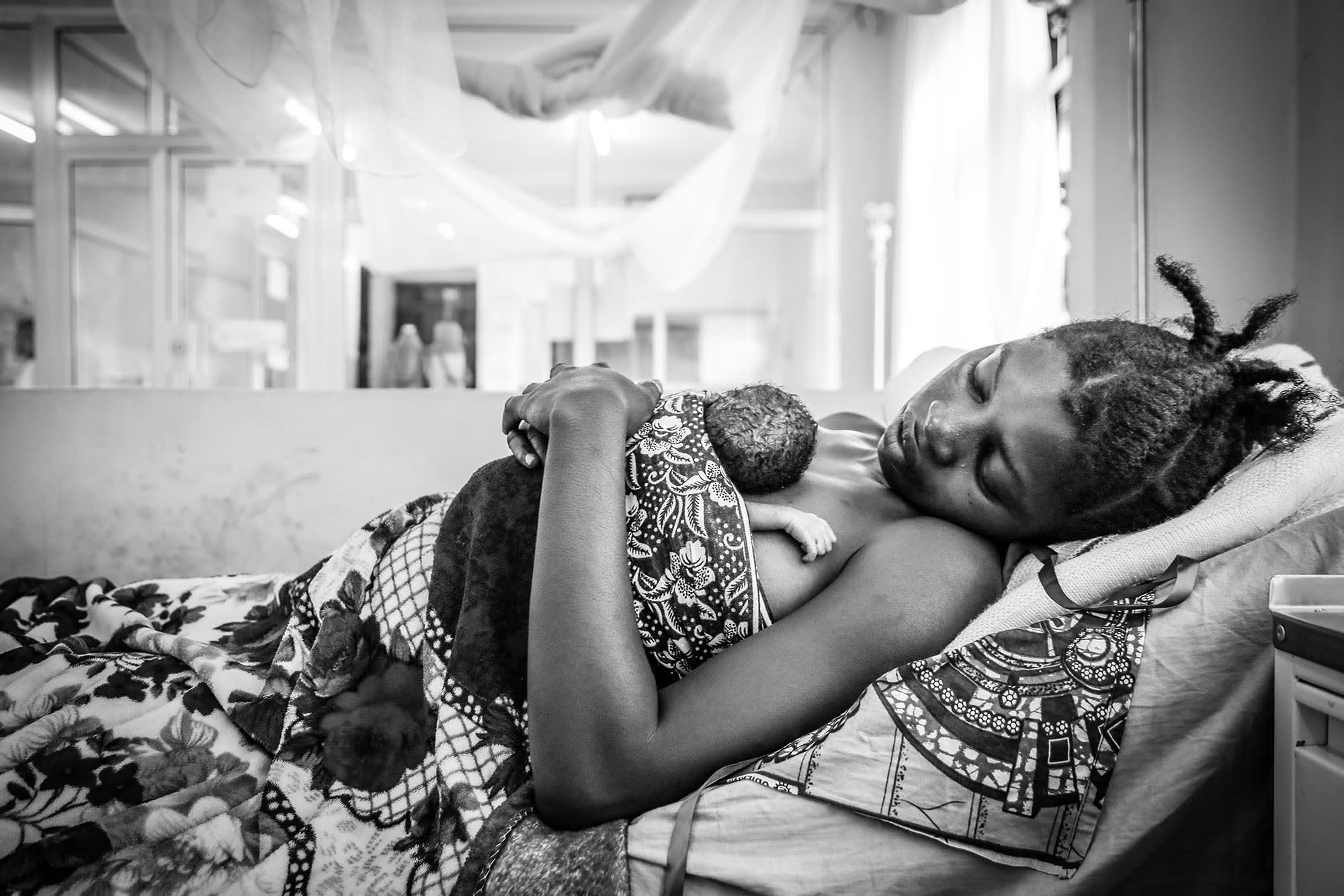 Premature baby Robert was born in a refugee camp in Tanzania. Here he takes a moment to rest in his mother’s arms.