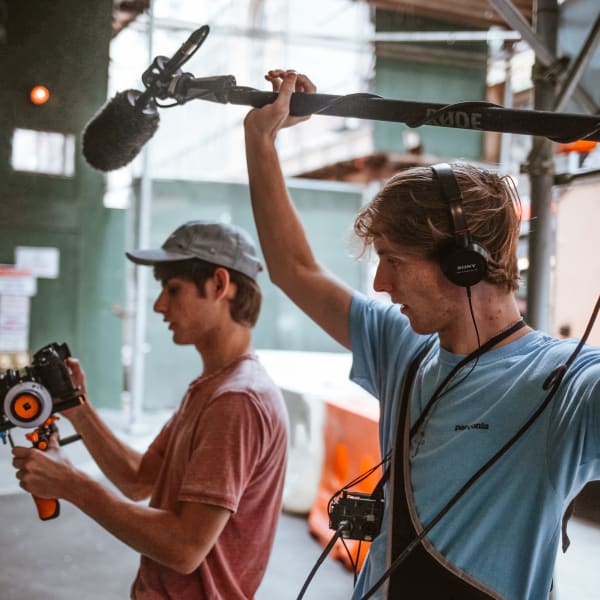 Film students using camera and sound kit