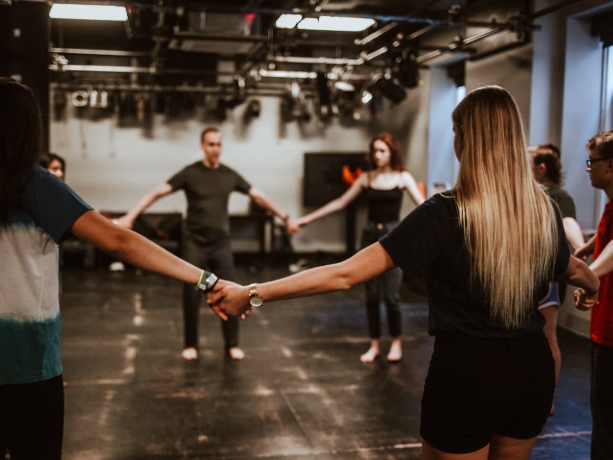 Acting students in circle exercise