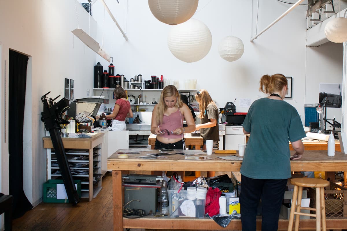 Photography student in darkroom