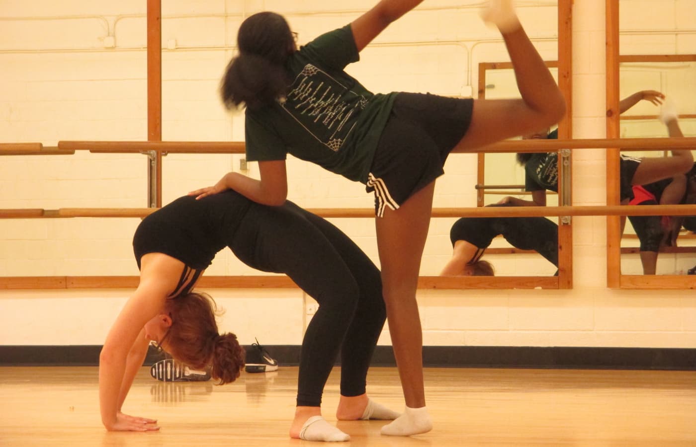 Dancers rehearsing student choreography in a dance studio