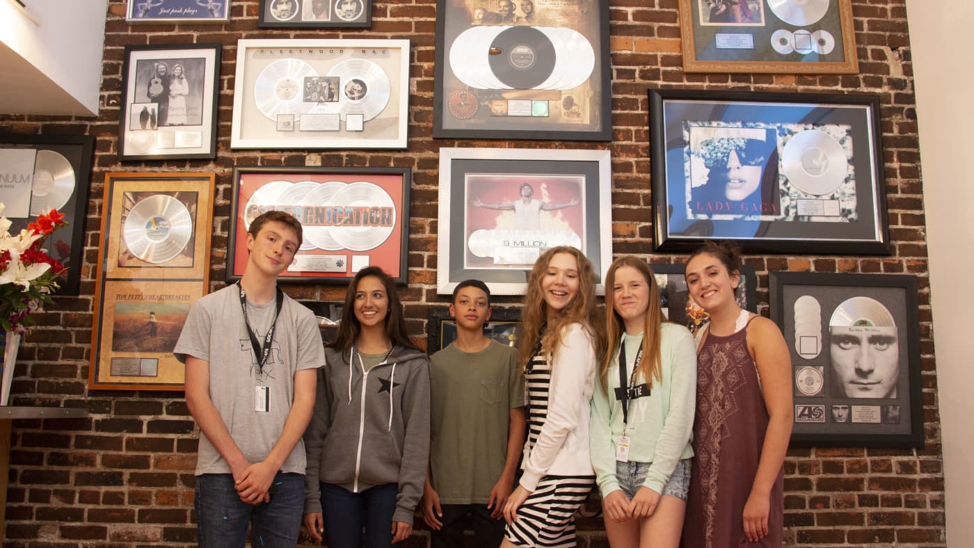 Teen musicians recording in studio