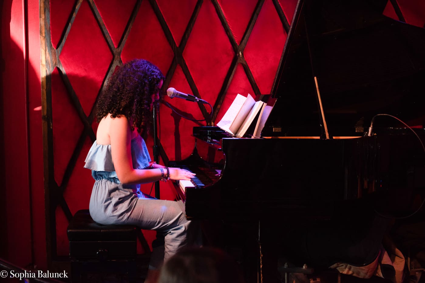 Teen singer at piano