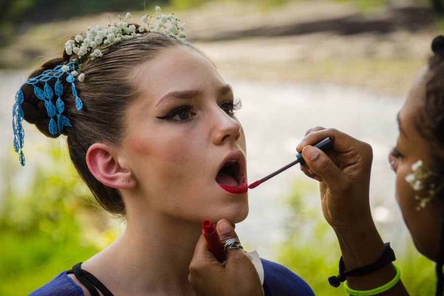 Teen dancer during make-up and costume session