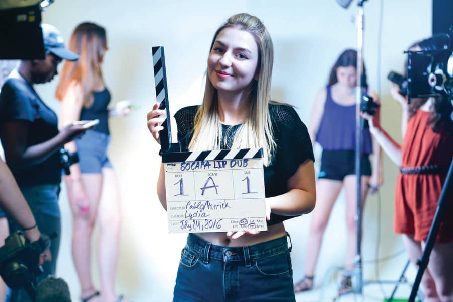 Girl with slate for film production