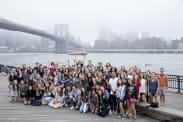 camp group in front of Brooklyn Bridge
