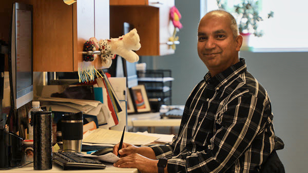 Dr. Shamal Wijay at his workstation