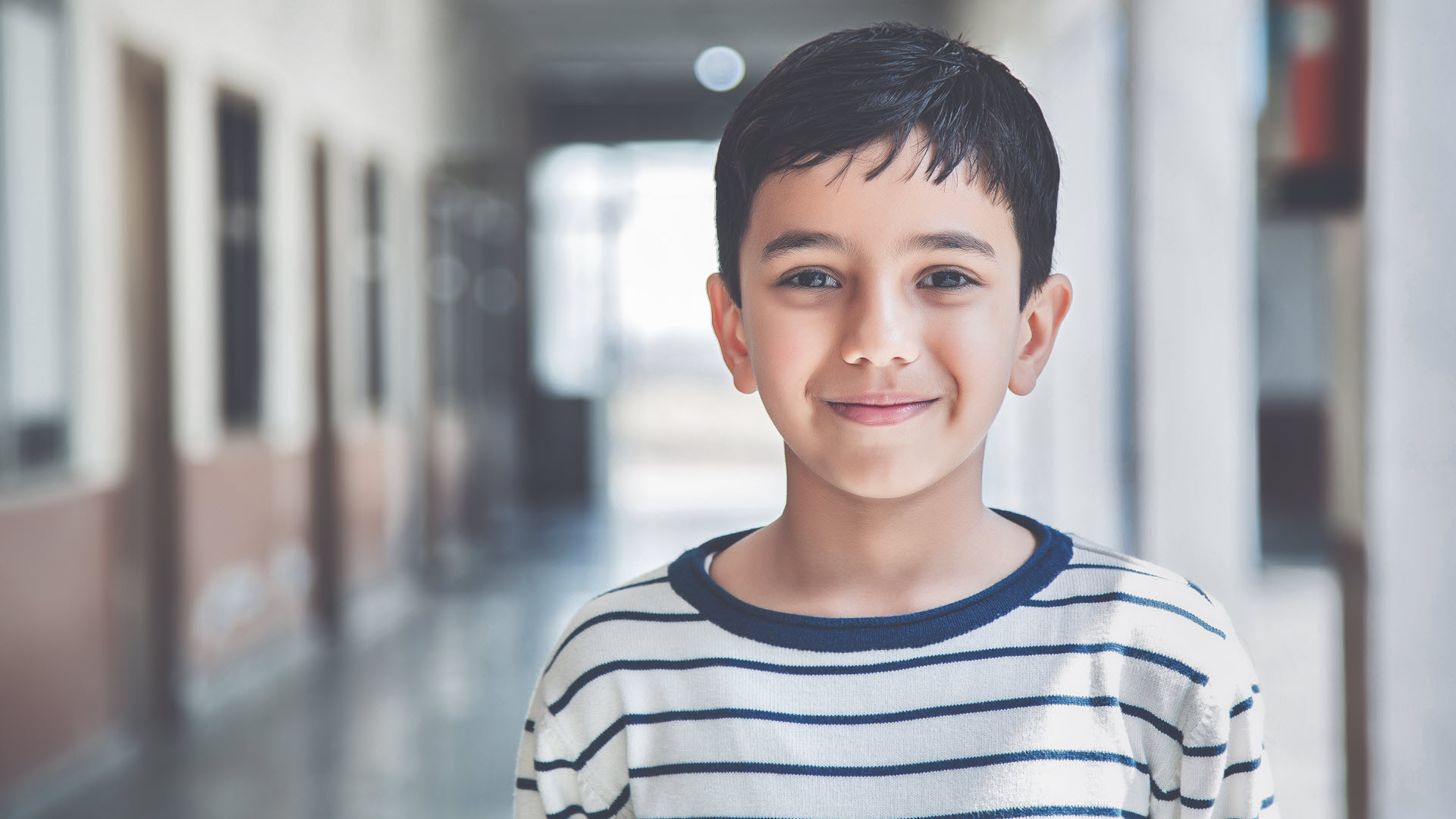 Young boy returning to school after COVID