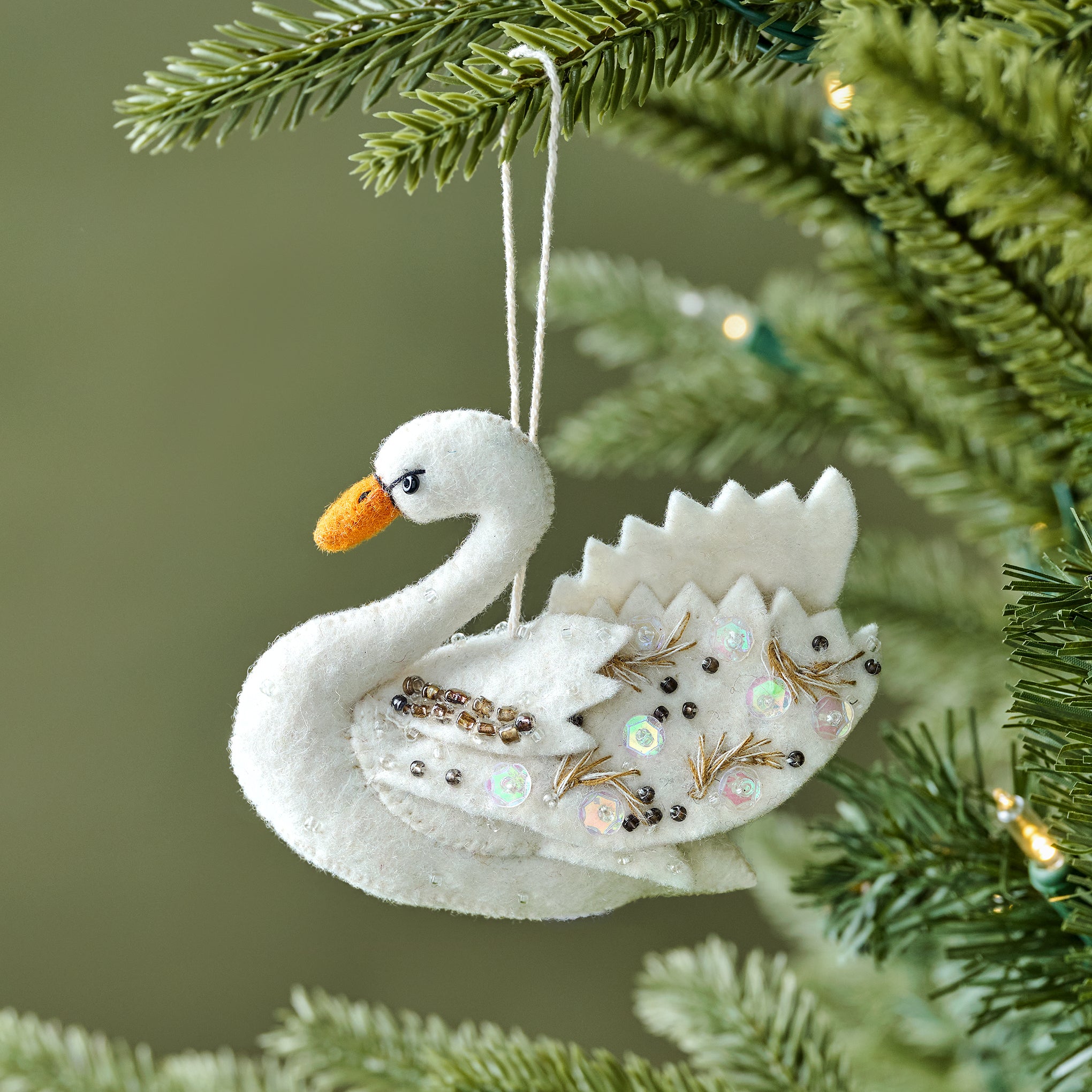 Hand-Felted Beaded Swan Ornament shown on tree