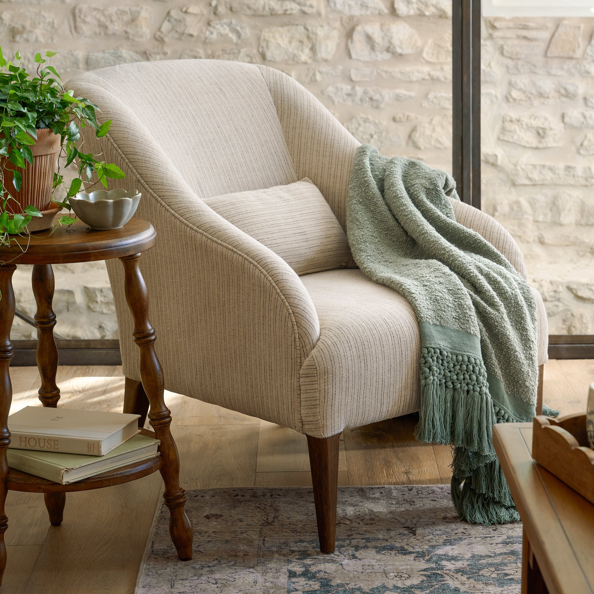 Freya Chair in a room with a throw blanket on top $999.00