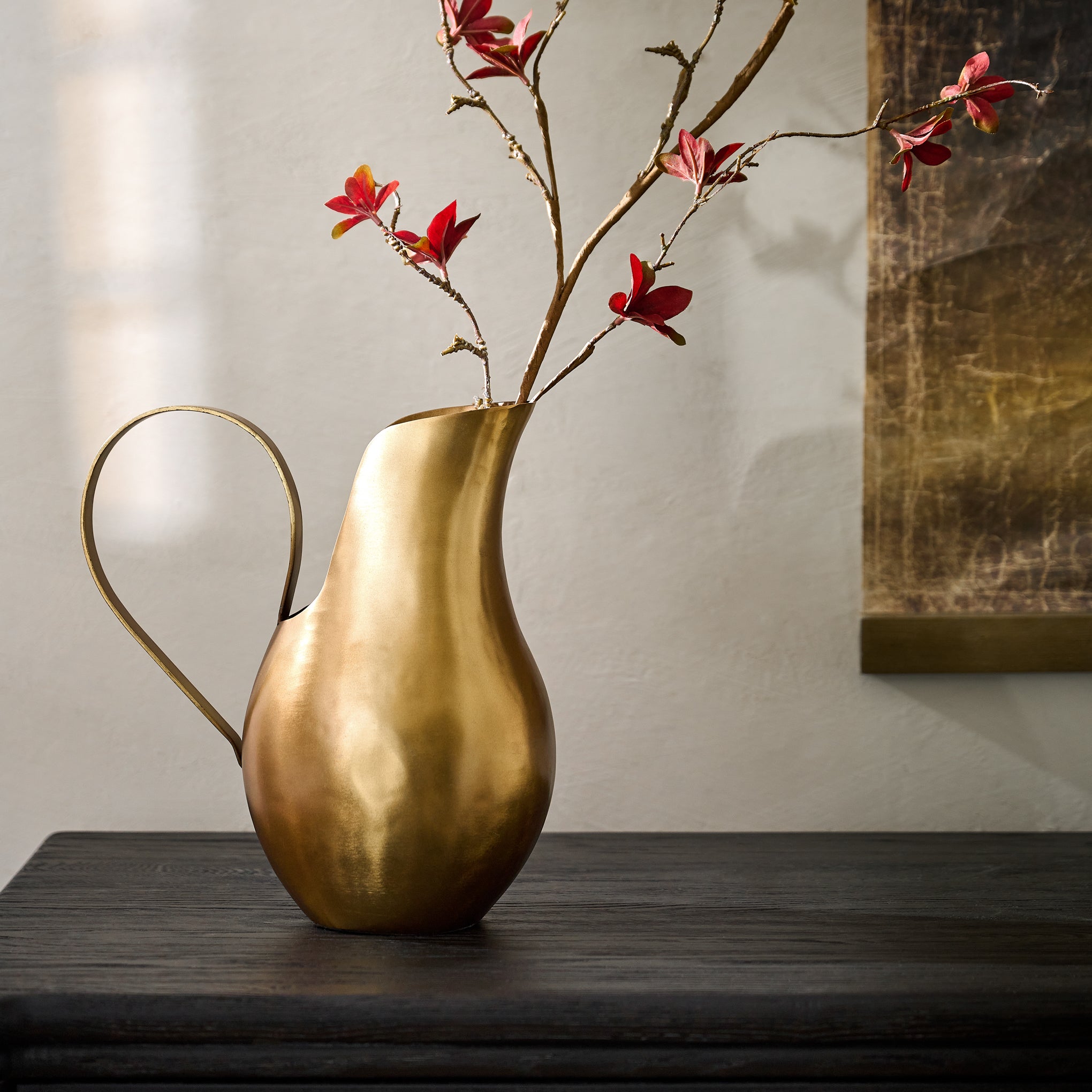 Antique Brass Pitcher Vase shown on table with florals