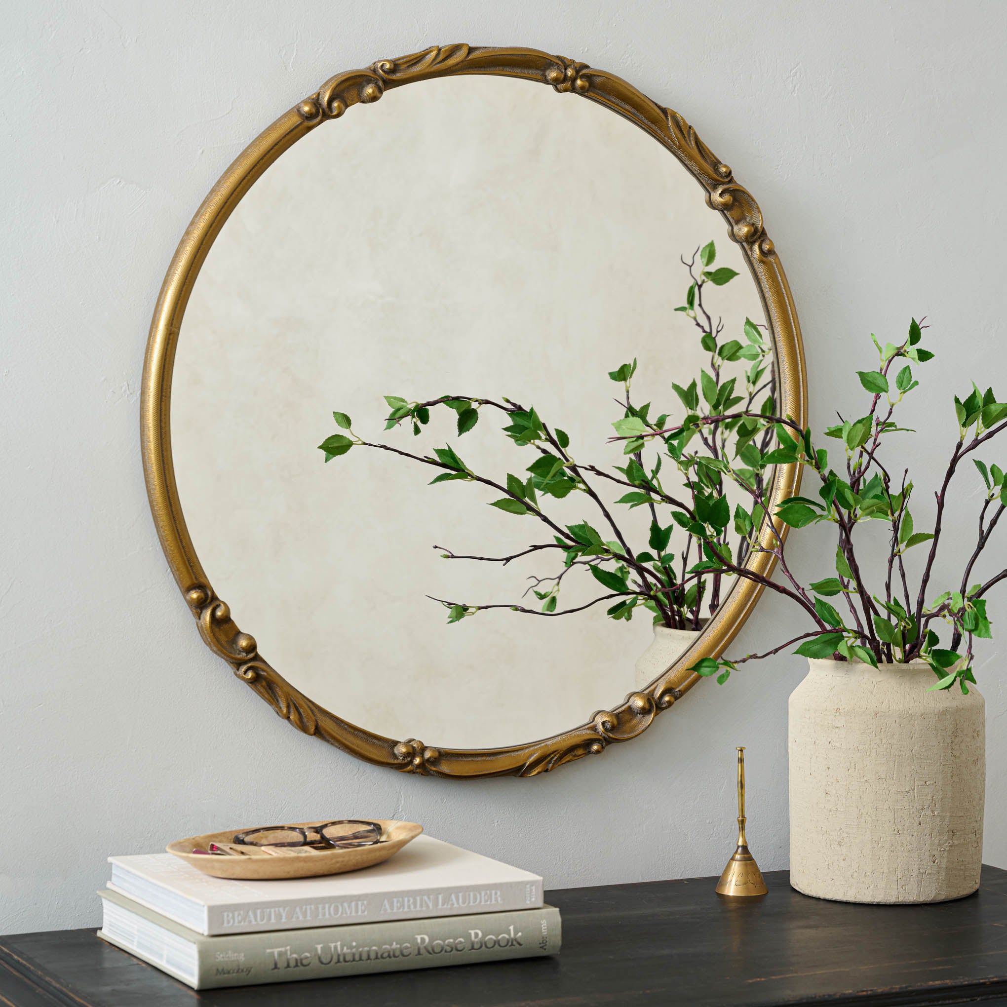 Josephine Round Wall Mirror above a dresser On sale for $134.40, discounted from $168.00