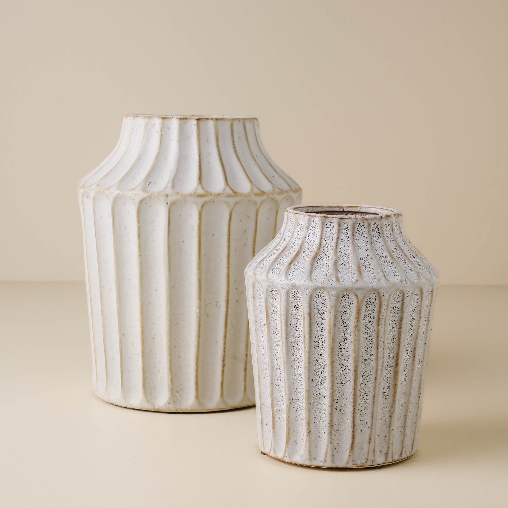 large and small sized ribbed white vases $64.00