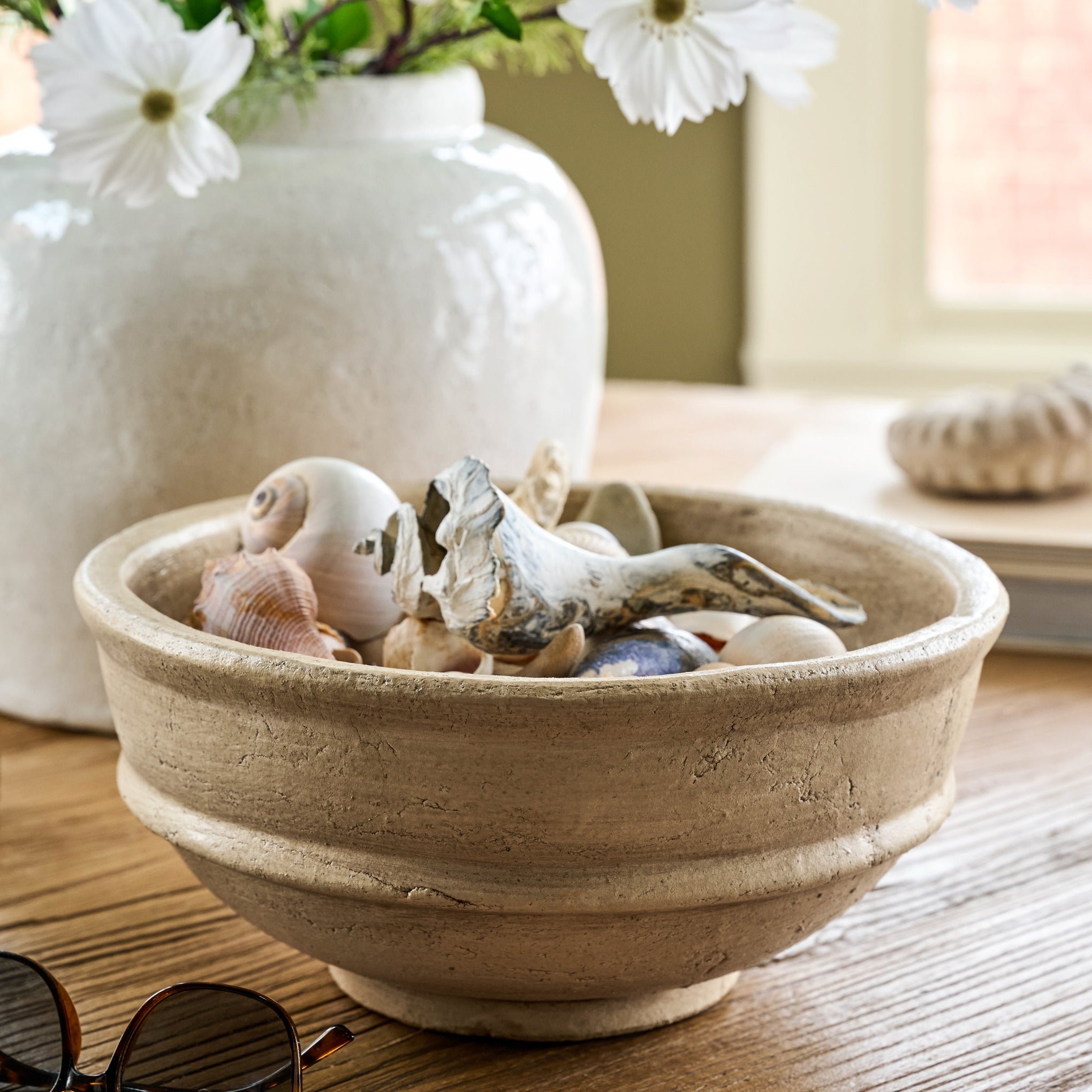 Textured Oversized Bowl on a table with seashells inside $48.00