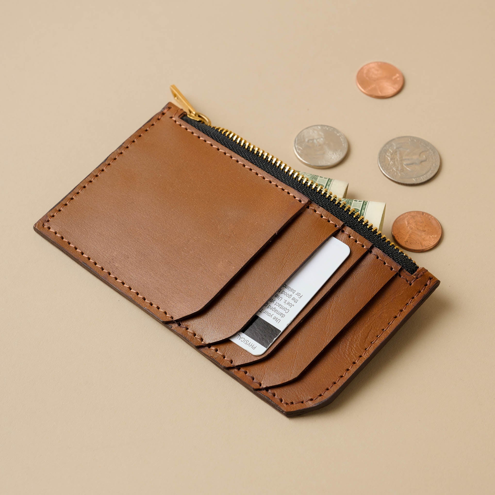 Magnolia Essential Caramel Card Holder with cards and coins On sale for $47.60, discounted from $68.00