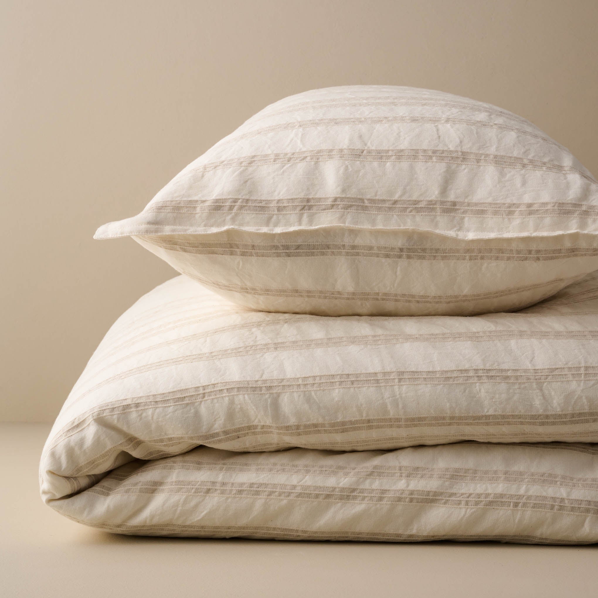 Folded Embroidered Oatmeal Stripe Linen Cotton Duvet and Pillow ShamItems range from $198.00 to $248.00