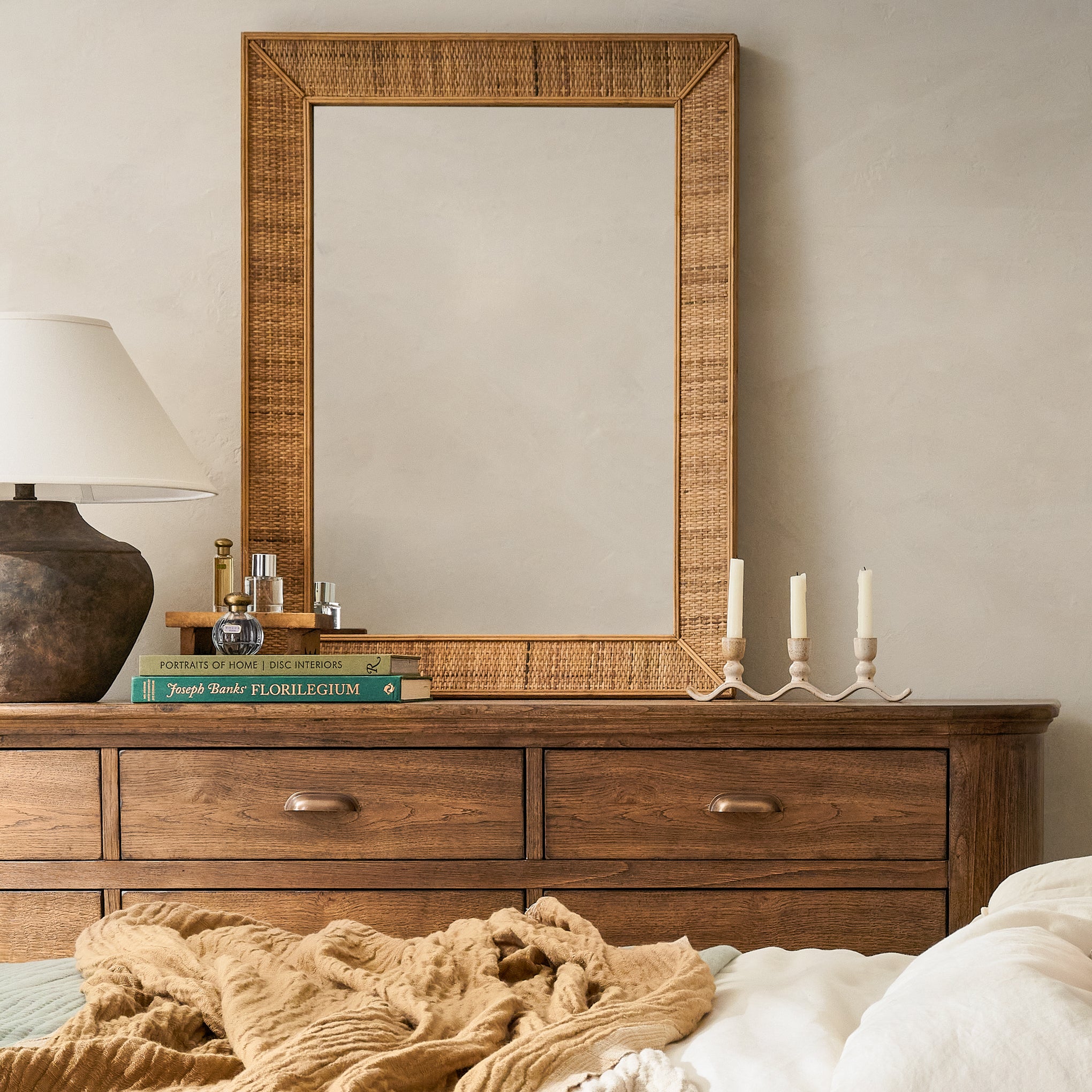 Perry Rattan Mirror on a dresser