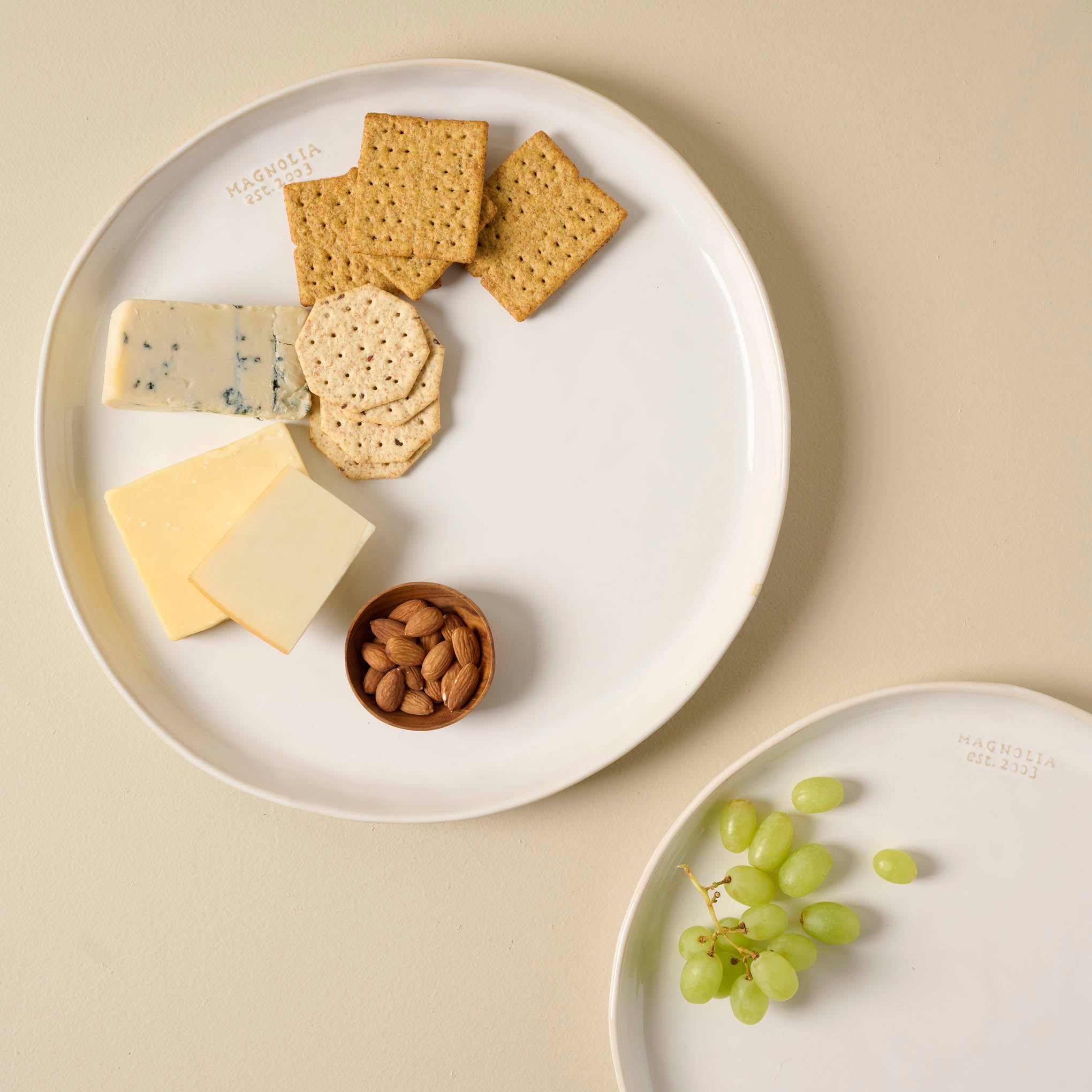 Magnolia Est. Ceramic Round Platter with cheese and crackers