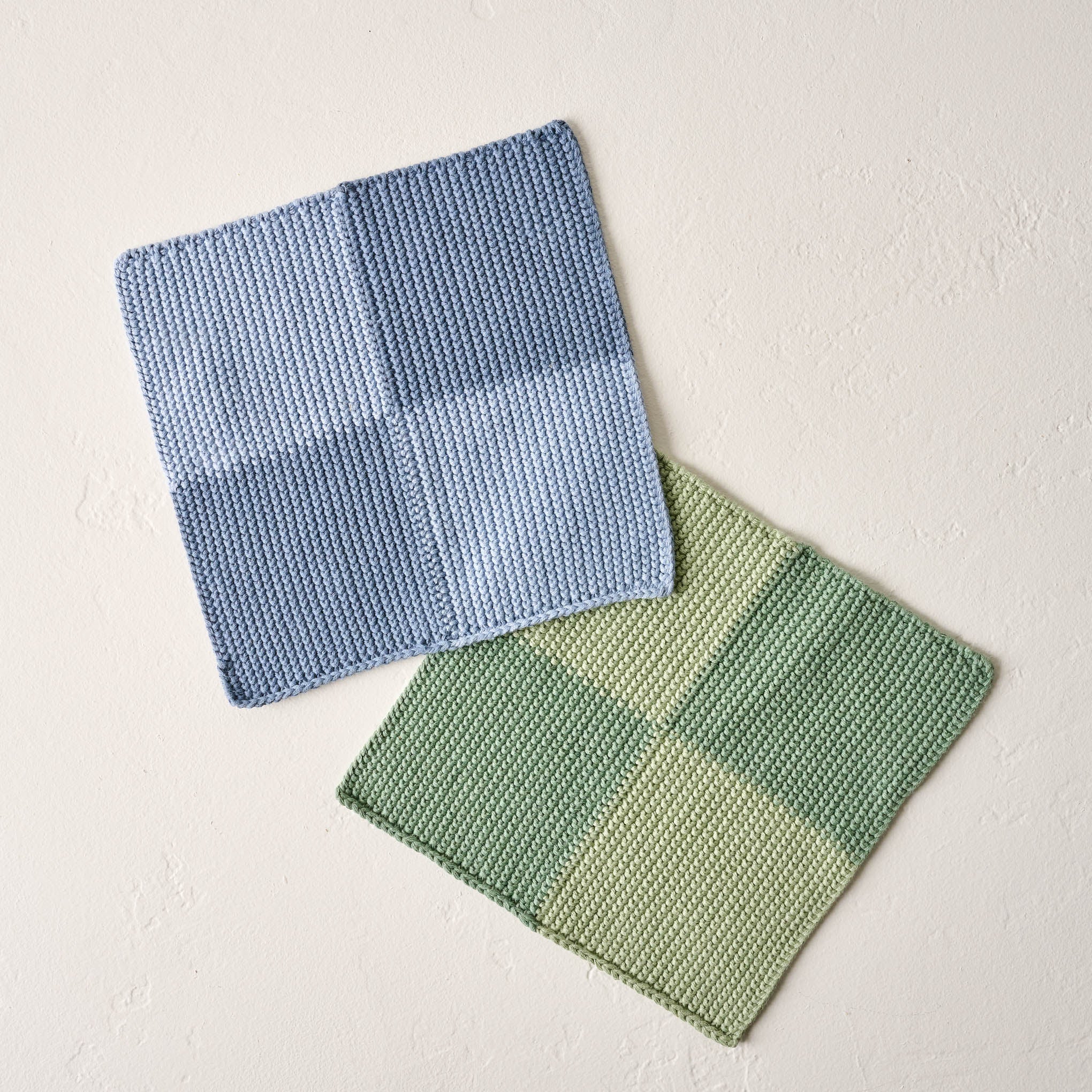 two cotton knitted washcloths in blue checkerboard and green checkerboard $20.00